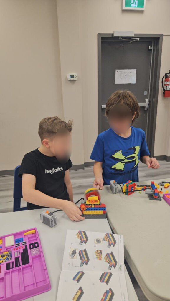 Kids solving LEGO building challenges in Calgary