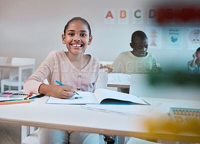 Happy child studying at desk
