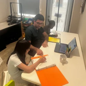 Small after school math tutoring group in Calgary Sage Hill where a tutor helps children understand math concepts.